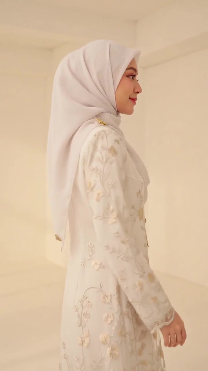 Lydia Farida in a dusty-rose hijab smiling on an outdoor walk